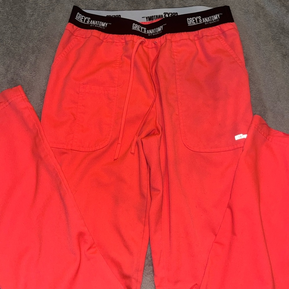 Bright, neon pink greys anatomy scrub pants